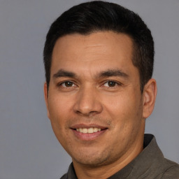 Joyful white adult male with short  brown hair and brown eyes