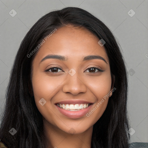 Joyful latino young-adult female with long  black hair and brown eyes