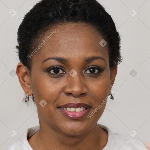 Joyful black young-adult female with short  brown hair and brown eyes