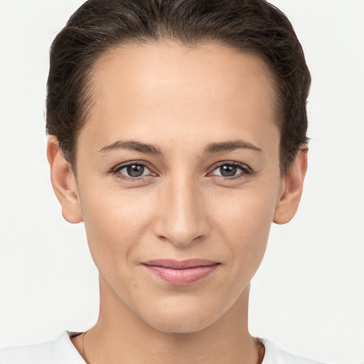 Joyful white young-adult female with medium  brown hair and brown eyes