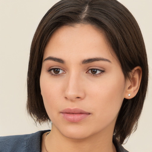 Neutral white young-adult female with medium  brown hair and brown eyes