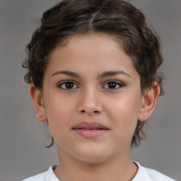 Joyful white child female with short  brown hair and brown eyes