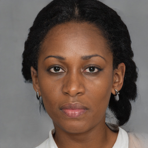 Neutral black young-adult female with medium  black hair and brown eyes