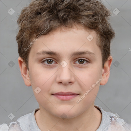 Joyful white child male with short  brown hair and brown eyes