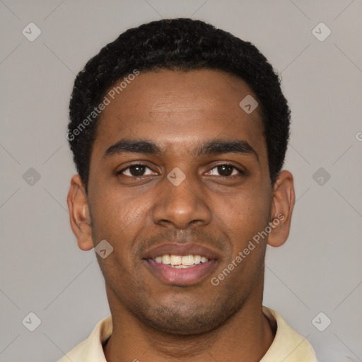 Joyful black young-adult male with short  black hair and brown eyes