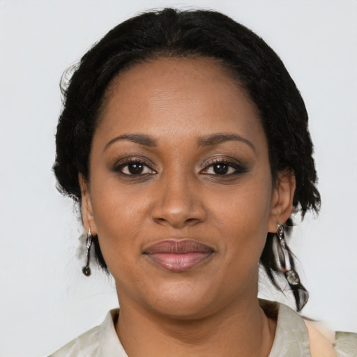 Joyful black young-adult female with medium  black hair and brown eyes