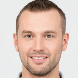 Joyful white young-adult male with short  brown hair and brown eyes