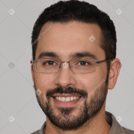 Joyful white young-adult male with short  black hair and brown eyes