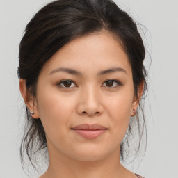 Joyful asian young-adult female with medium  brown hair and brown eyes