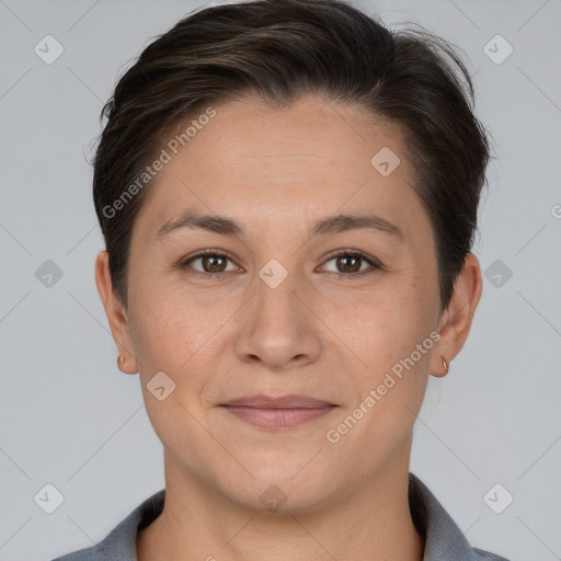 Joyful white adult female with short  brown hair and brown eyes