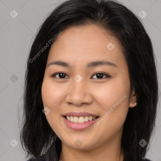 Joyful asian young-adult female with long  brown hair and brown eyes