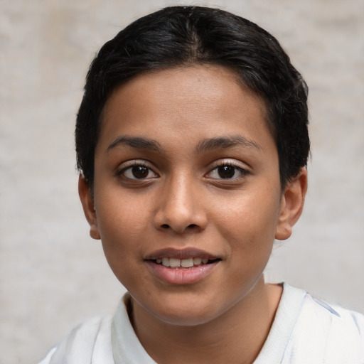 Joyful latino young-adult female with short  brown hair and brown eyes