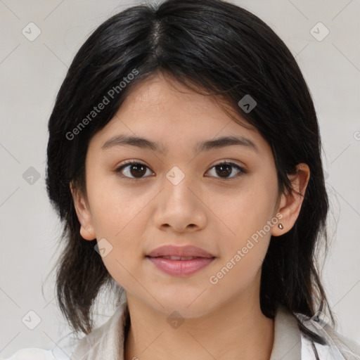 Joyful latino young-adult female with medium  brown hair and brown eyes