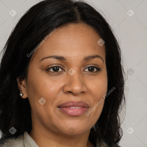 Joyful black adult female with long  brown hair and brown eyes