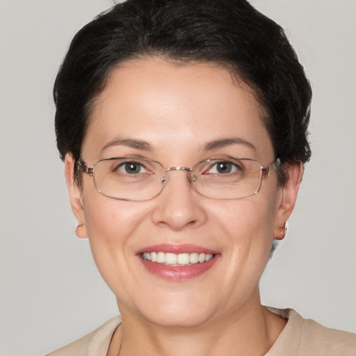 Joyful white adult female with short  brown hair and grey eyes