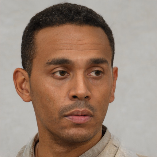 Neutral latino young-adult male with short  brown hair and brown eyes