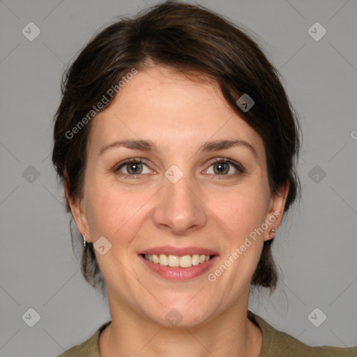 Joyful white young-adult female with medium  brown hair and green eyes