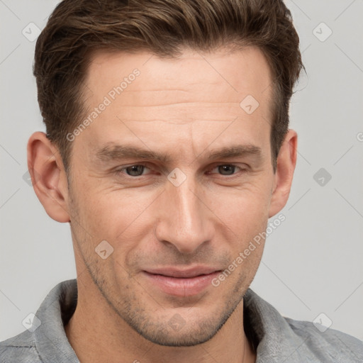 Joyful white adult male with short  brown hair and grey eyes