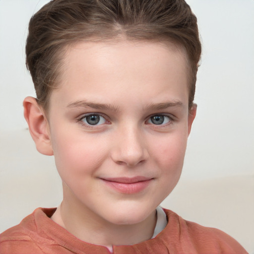 Joyful white child female with short  brown hair and grey eyes