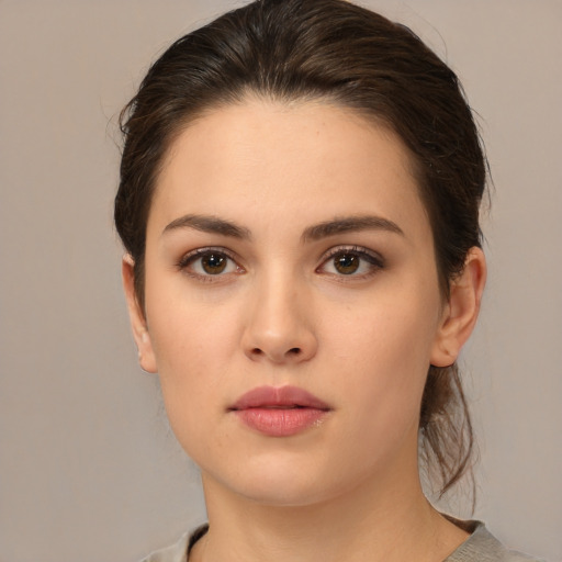 Neutral white young-adult female with medium  brown hair and brown eyes