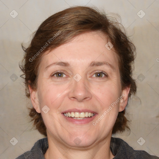 Joyful white adult female with medium  brown hair and blue eyes