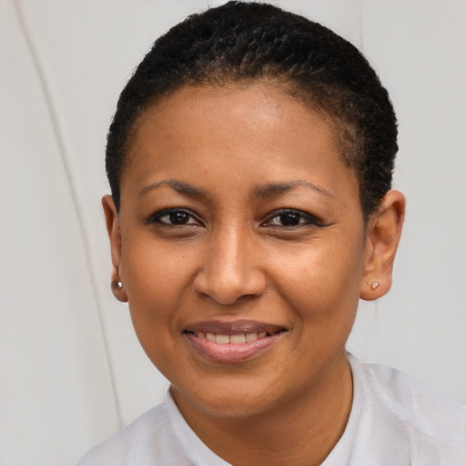 Joyful black young-adult female with short  brown hair and brown eyes