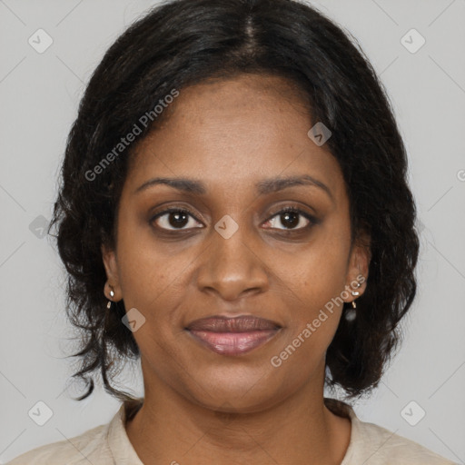 Joyful black young-adult female with long  brown hair and brown eyes