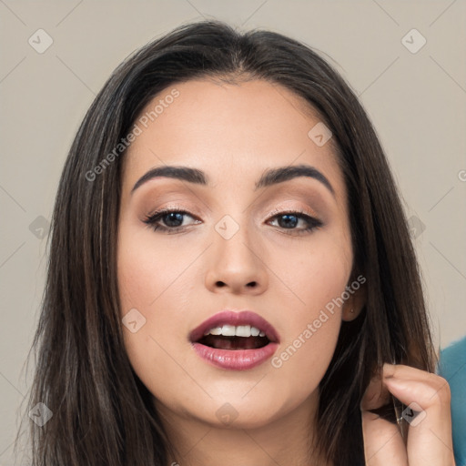 Joyful asian young-adult female with long  brown hair and brown eyes