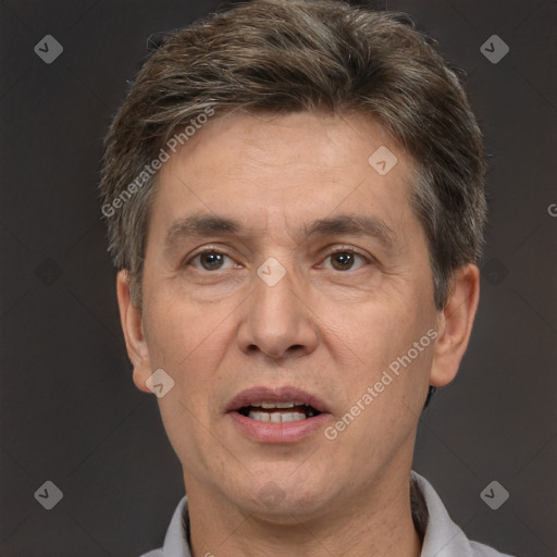 Joyful white adult male with short  brown hair and brown eyes