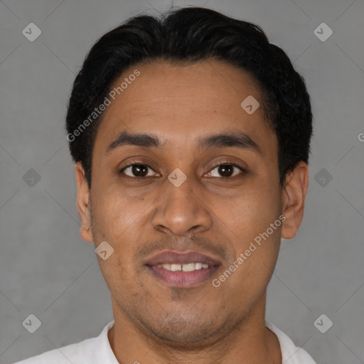 Joyful latino young-adult male with short  black hair and brown eyes
