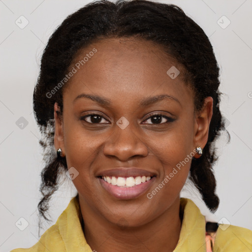 Joyful black young-adult female with medium  brown hair and brown eyes