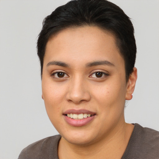 Joyful asian young-adult female with short  black hair and brown eyes