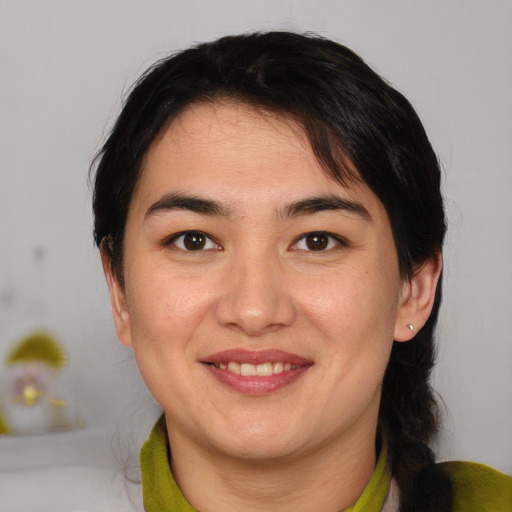 Joyful white young-adult female with medium  brown hair and brown eyes