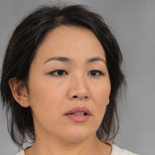 Neutral asian young-adult female with medium  brown hair and brown eyes