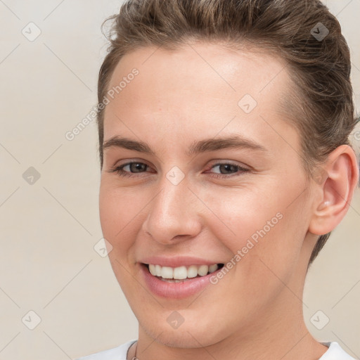 Joyful white young-adult female with short  brown hair and brown eyes