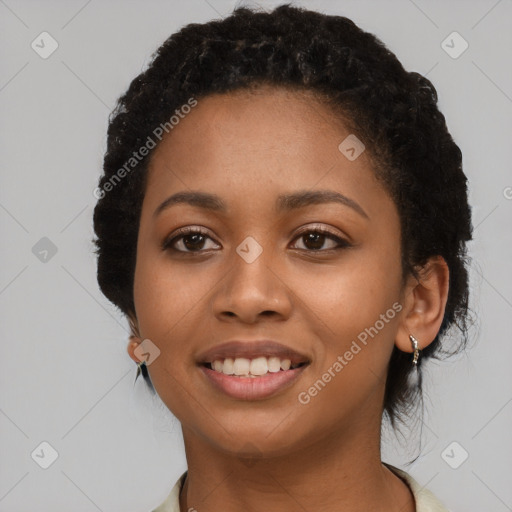 Joyful latino young-adult female with short  black hair and brown eyes