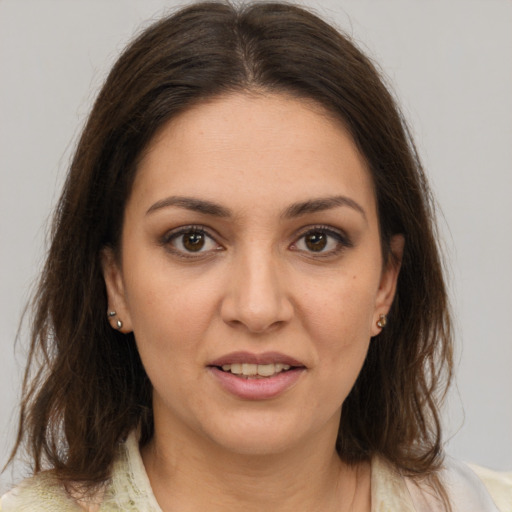 Joyful white young-adult female with medium  brown hair and brown eyes