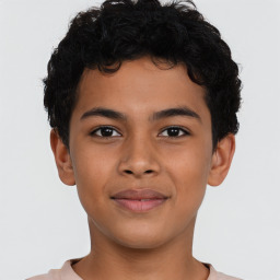 Joyful latino child male with short  brown hair and brown eyes