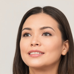 Joyful white young-adult female with long  black hair and brown eyes