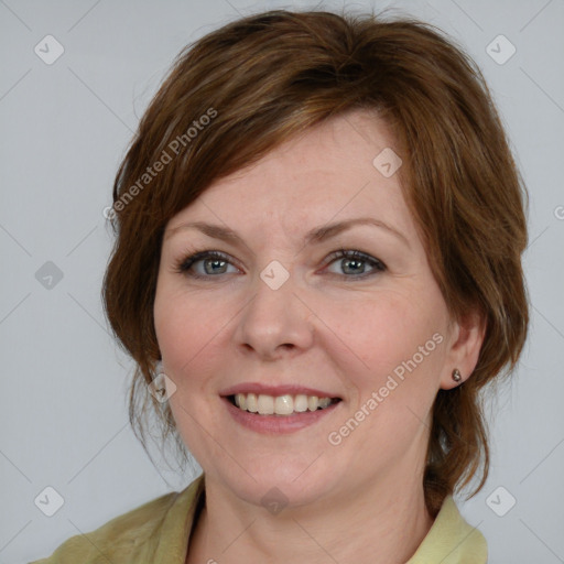 Joyful white young-adult female with medium  brown hair and blue eyes