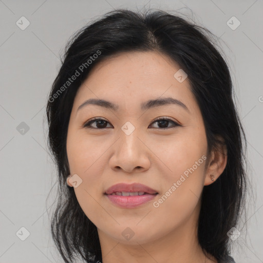 Joyful asian young-adult female with medium  black hair and brown eyes