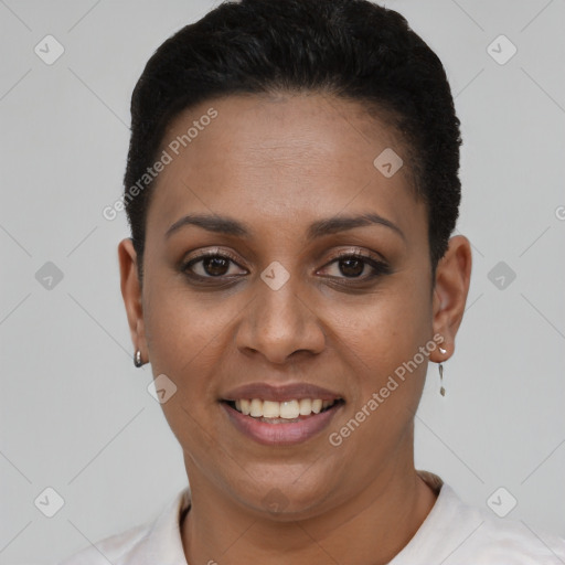 Joyful black young-adult female with short  black hair and brown eyes