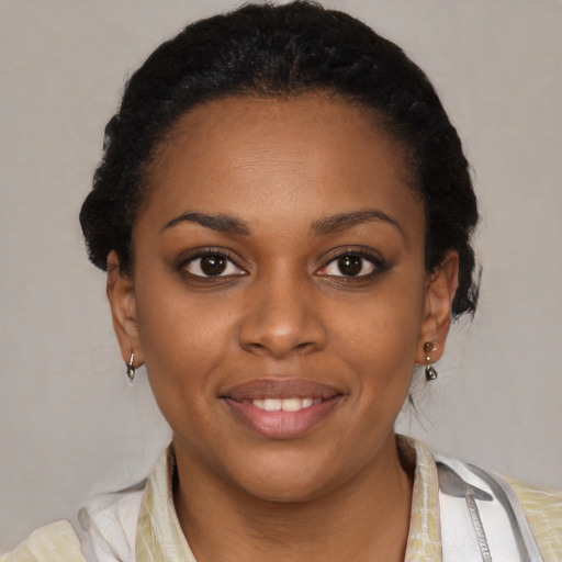Joyful latino young-adult female with short  brown hair and brown eyes