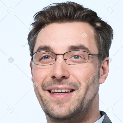 Joyful white adult male with short  brown hair and grey eyes