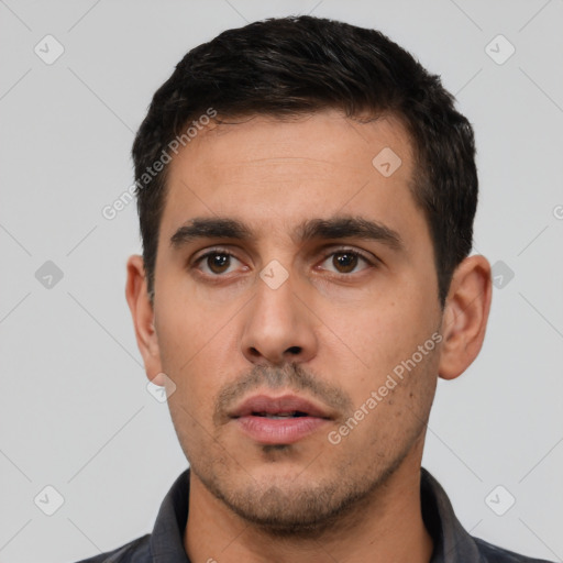 Neutral white young-adult male with short  black hair and brown eyes