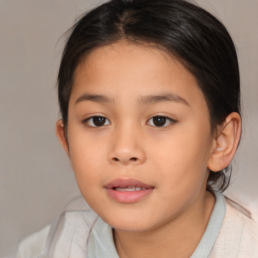 Joyful asian child female with medium  brown hair and brown eyes