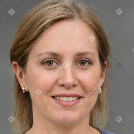 Joyful white adult female with medium  brown hair and grey eyes