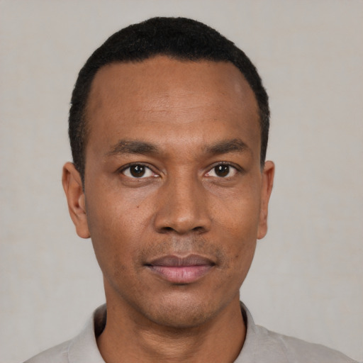 Neutral black young-adult male with short  black hair and brown eyes
