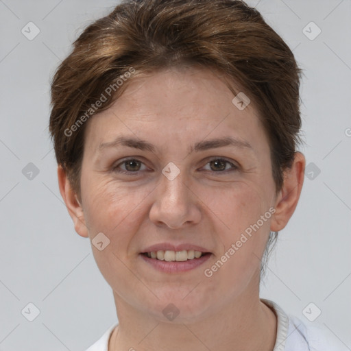Joyful white adult female with short  brown hair and brown eyes