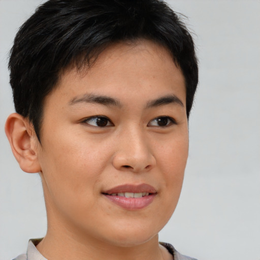 Joyful asian young-adult female with short  brown hair and brown eyes